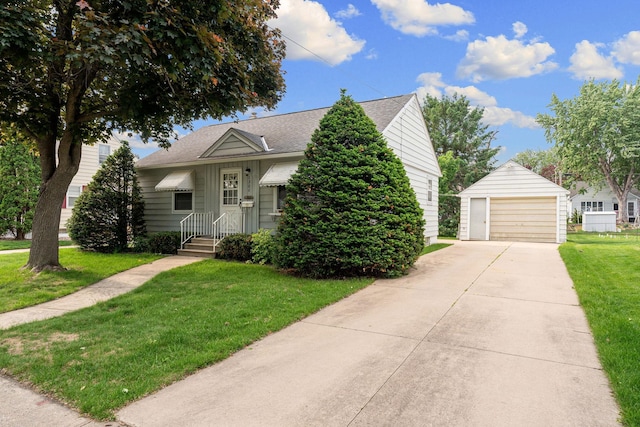 1306 6th Ave NW, Austin, MN 55912 - view of front of house with an outdoor structure, a front yard, a detached garage, and a shingled roof