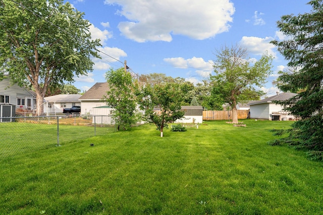 1306 6th Ave NW, Austin, MN 55912 - fenced backyard featuring a storage shed