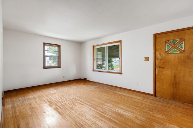 1306 6th Ave NW, Austin, MN 55912 - empty room featuring light wood-style flooring