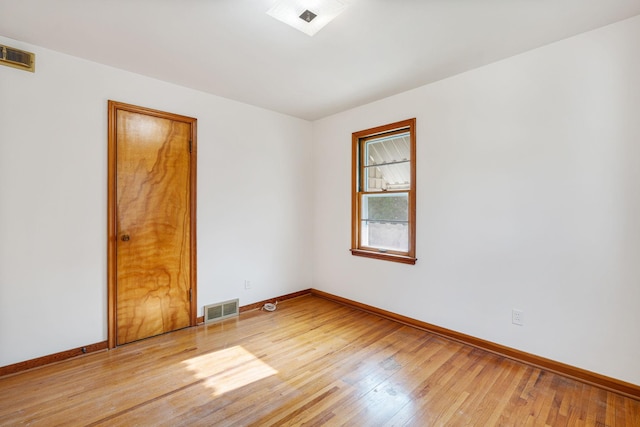 1306 6th Ave NW, Austin, MN 55912 - empty room with light wood-type flooring and baseboards