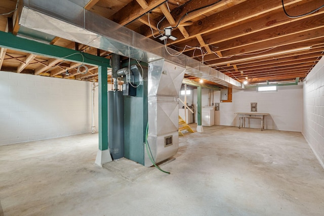 1306 6th Ave NW, Austin, MN 55912 - basement featuring washer / dryer, heating unit, water heater, and electric panel