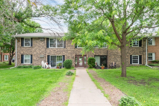 1006 Westbrooke Way Unit 2, Hopkins, MN 55343 - colonial inspired home featuring a front yard, french doors, and brick siding