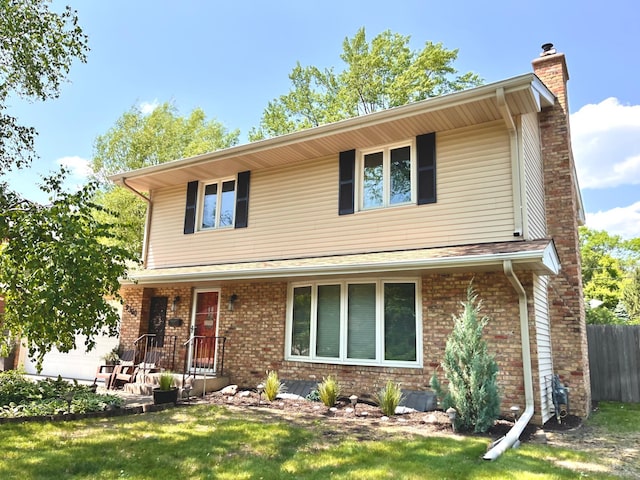 9300 23rd St, Saint Louis Park, MN 55426 - traditional-style home with a chimney, a porch, a front yard, and brick siding