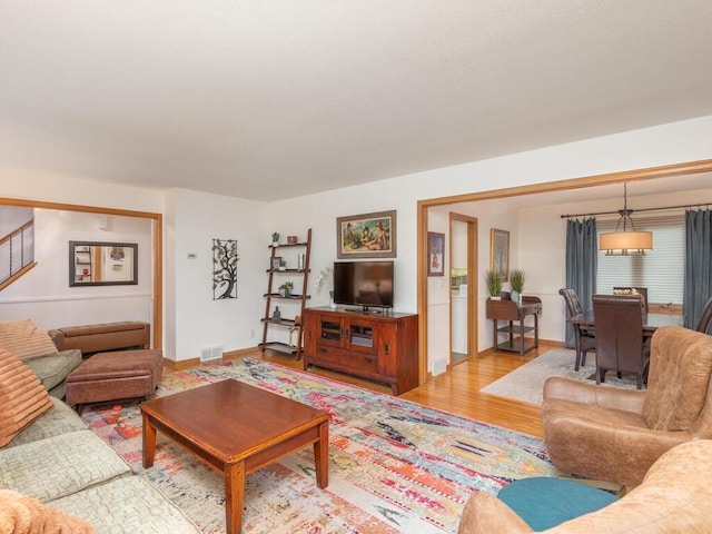 9300 23rd St, Saint Louis Park, MN 55426 - living room featuring wood finished floors, stairs, and baseboards