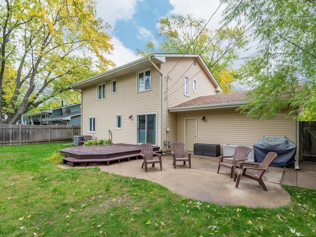 9300 23rd St, Saint Louis Park, MN 55426 - back of house featuring a deck, central AC, and a patio
