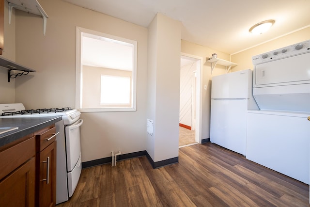 8247 Wentworth Ave S, Bloomington, MN 55420 - laundry area featuring dark wood-style flooring, stacked washer / drying machine, and baseboards