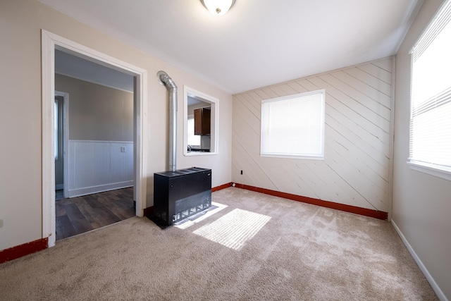 8247 Wentworth Ave S, Bloomington, MN 55420 - carpeted empty room featuring wood walls and baseboards