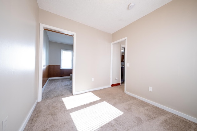 8247 Wentworth Ave S, Bloomington, MN 55420 - carpeted spare room featuring baseboards and a smoke detector