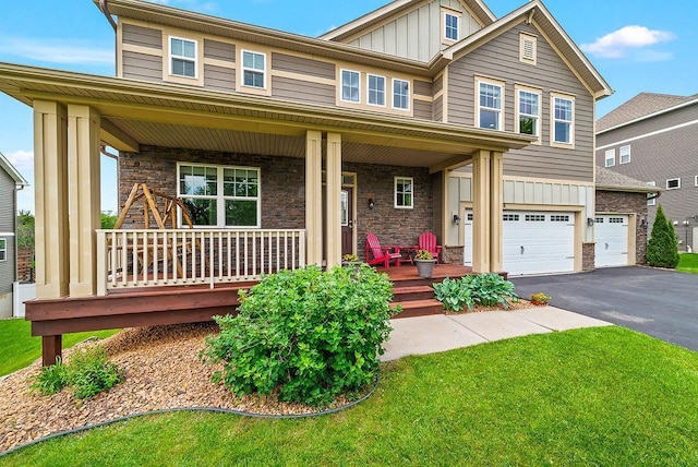 10388 188th St W, Lakeville, MN 55044 - craftsman inspired home with covered porch, board and batten siding, asphalt driveway, and stone siding