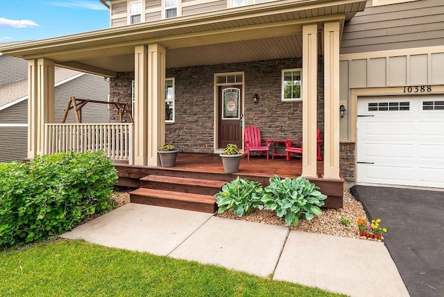 10388 188th St W, Lakeville, MN 55044 - doorway to property featuring covered porch and stone siding