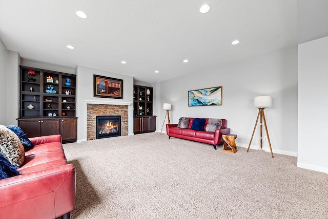 10388 188th St W, Lakeville, MN 55044 - carpeted living room featuring baseboards, recessed lighting, and a stone fireplace
