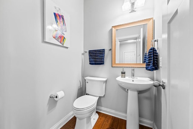 10388 188th St W, Lakeville, MN 55044 - half bathroom with baseboards, toilet, and wood finished floors