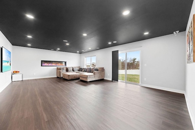 10388 188th St W, Lakeville, MN 55044 - living room featuring dark wood-style floors, recessed lighting, and baseboards