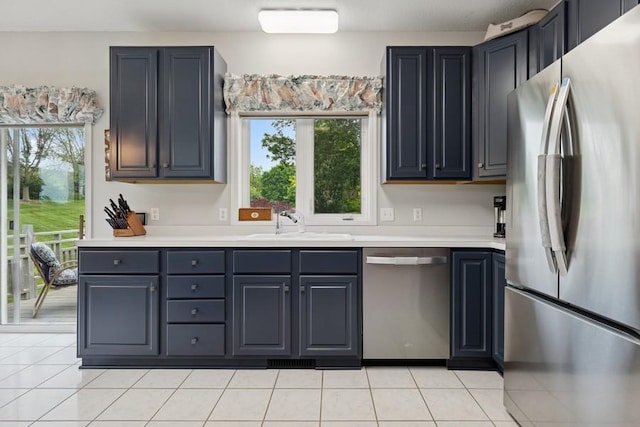 3114 Canyon Cir, Chaska, MN 55318 - kitchen with stainless steel appliances, light tile patterned flooring, and light countertops