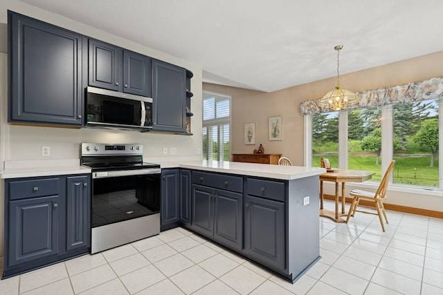 3114 Canyon Cir, Chaska, MN 55318 - kitchen featuring appliances with stainless steel finishes, a peninsula, light countertops, light tile patterned floors, and decorative light fixtures