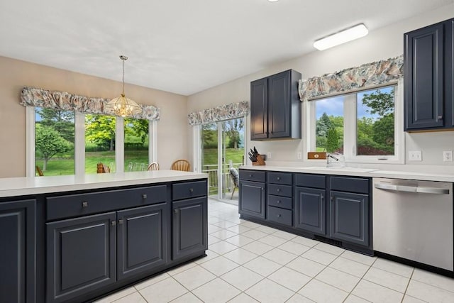 3114 Canyon Cir, Chaska, MN 55318 - kitchen with stainless steel dishwasher, light countertops, light tile patterned floors, and decorative light fixtures