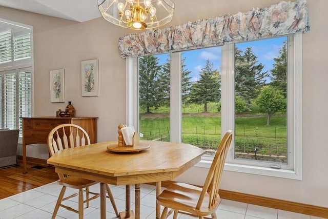 3114 Canyon Cir, Chaska, MN 55318 - dining room with light tile patterned floors and a chandelier