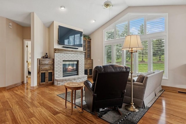 3114 Canyon Cir, Chaska, MN 55318 - living area featuring lofted ceiling, a fireplace, and wood finished floors