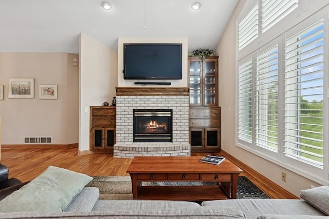 3114 Canyon Cir, Chaska, MN 55318 - living area featuring wood finished floors, a fireplace, and recessed lighting