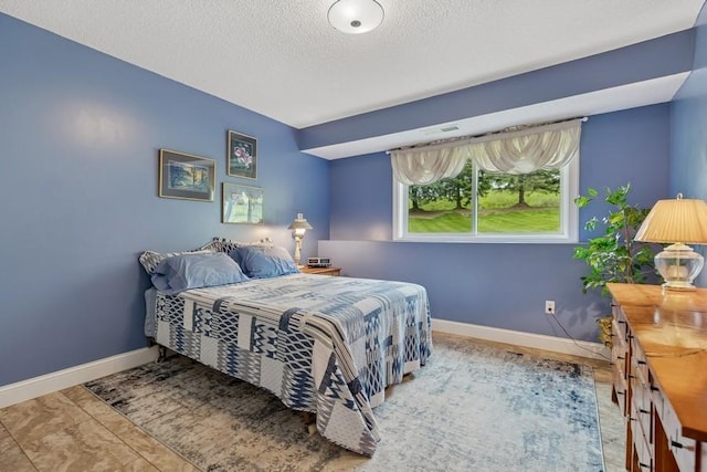 3114 Canyon Cir, Chaska, MN 55318 - bedroom featuring baseboards and a textured ceiling