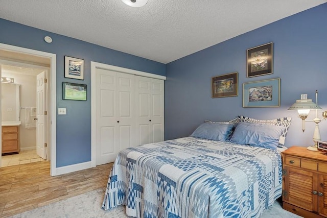 3114 Canyon Cir, Chaska, MN 55318 - bedroom featuring wood finished floors, a closet, and a textured ceiling