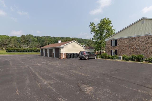 2051 Carriage Dr SW Unit 2051E, Rochester, MN 55902 - view of car parking featuring community garages