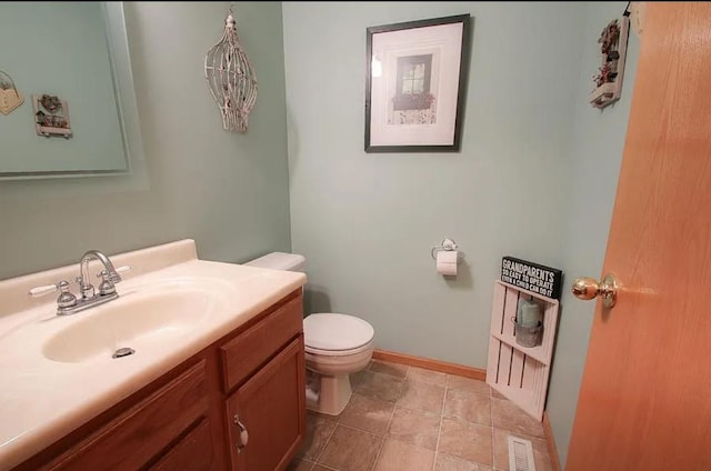 23501 Birch Cir, Rogers, MN 55374 - bathroom featuring toilet, vanity, and baseboards