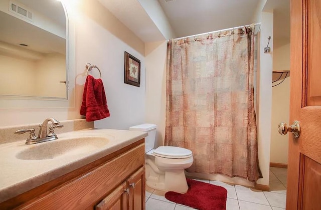 23501 Birch Cir, Rogers, MN 55374 - bathroom with vanity, toilet, tile patterned floors, and a shower with shower curtain