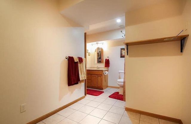 23501 Birch Cir, Rogers, MN 55374 - bathroom featuring toilet, vanity, tile patterned floors, and baseboards
