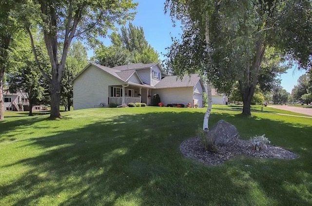 23501 Birch Cir, Rogers, MN 55374 - traditional-style home featuring a front yard, a porch, and an attached garage