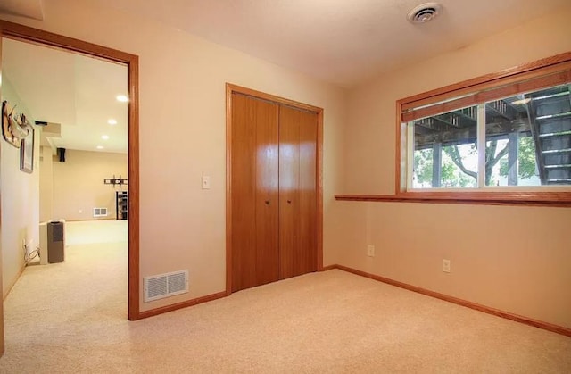 23501 Birch Cir, Rogers, MN 55374 - unfurnished bedroom featuring carpet flooring, a closet, and baseboards