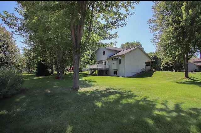 23501 Birch Cir, Rogers, MN 55374 - view of grassy yard featuring a deck
