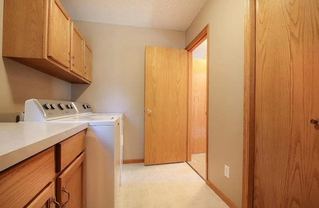23501 Birch Cir, Rogers, MN 55374 - laundry room featuring washing machine and clothes dryer, cabinet space, light flooring, and baseboards