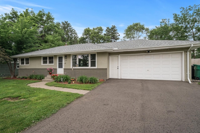179 County Road F W, Shoreview, MN 55126 - ranch-style house featuring driveway, stucco siding, an attached garage, a front yard, and brick siding