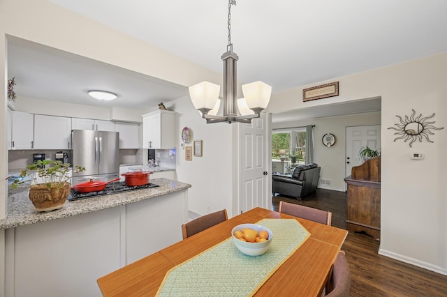 179 County Road F W, Shoreview, MN 55126 - dining room with dark wood-style floors and a chandelier