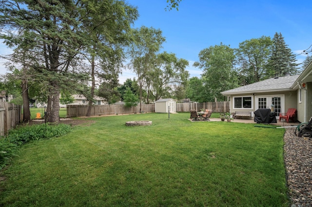179 County Road F W, Shoreview, MN 55126 - fenced backyard featuring a shed, a patio, and a fire pit