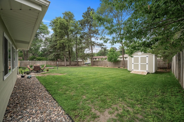 179 County Road F W, Shoreview, MN 55126 - fenced backyard featuring a storage unit and a patio