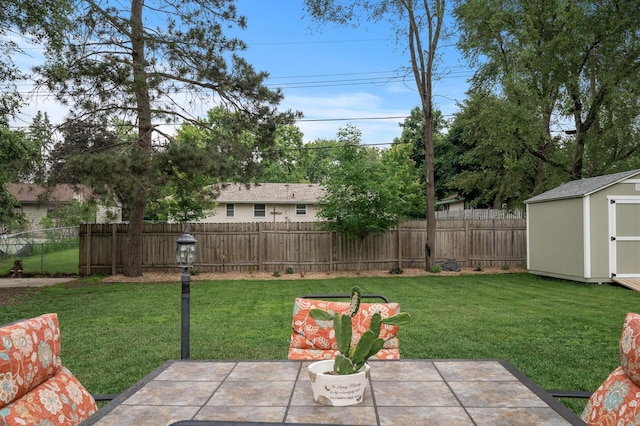 179 County Road F W, Shoreview, MN 55126 - fenced backyard with a storage shed and a patio area