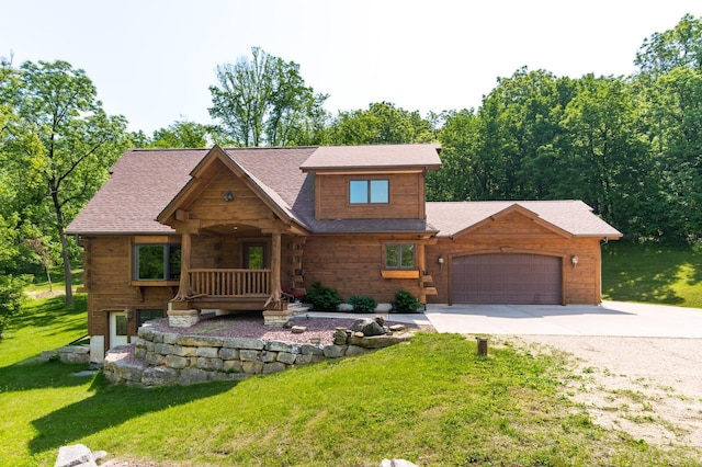 278 Vanity Dr, Shelby Twp, WI 54658 - cabin with driveway, an attached garage, a front lawn, covered porch, and roof with shingles