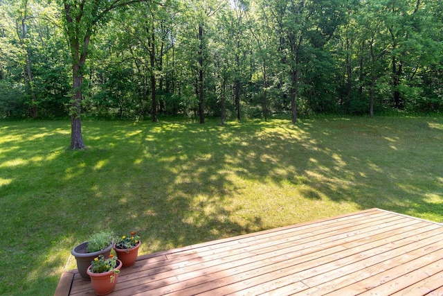 278 Vanity Dr, Shelby Twp, WI 54658 - view of grassy yard featuring a wooden deck and a wooded view