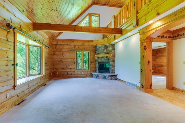 278 Vanity Dr, Shelby Twp, WI 54658 - unfurnished living room featuring carpet flooring, a fireplace, high vaulted ceiling, wood ceiling, and wood walls