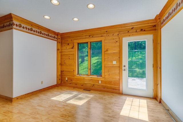 278 Vanity Dr, Shelby Twp, WI 54658 - unfurnished room featuring recessed lighting, light wood-type flooring, baseboards, and wood walls