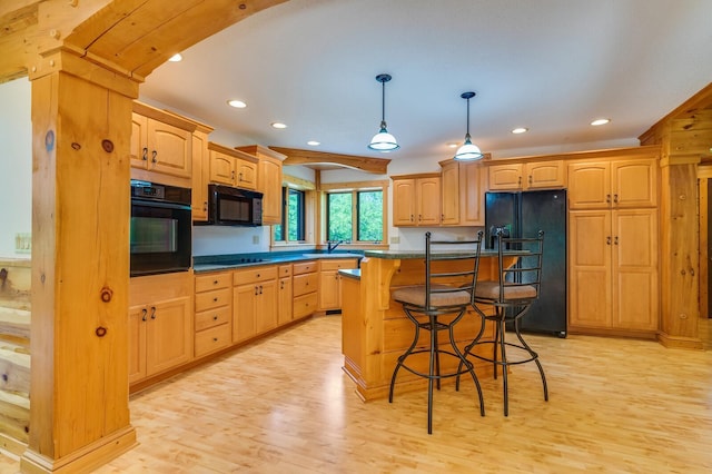 278 Vanity Dr, Shelby Twp, WI 54658 - kitchen with black appliances, a kitchen bar, recessed lighting, and light wood-style flooring