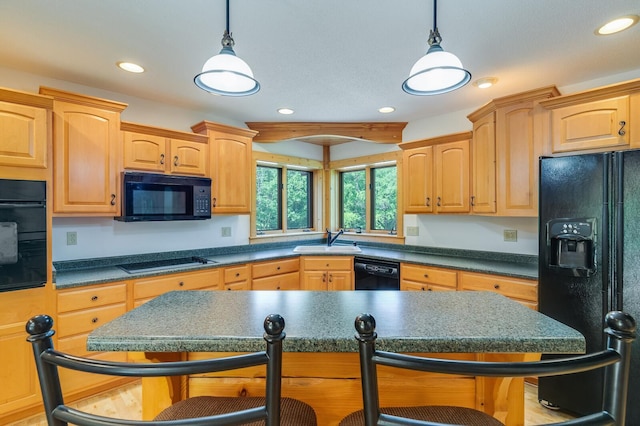 278 Vanity Dr, Shelby Twp, WI 54658 - kitchen featuring black appliances, a sink, a kitchen bar, recessed lighting, and hanging light fixtures