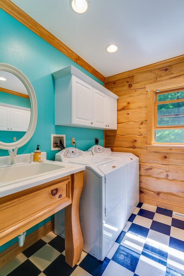 278 Vanity Dr, Shelby Twp, WI 54658 - laundry room with light flooring, cabinet space, independent washer and dryer, wood walls, and recessed lighting