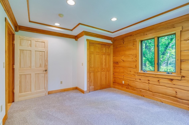 278 Vanity Dr, Shelby Twp, WI 54658 - unfurnished bedroom with carpet flooring, crown molding, a closet, recessed lighting, and wooden walls