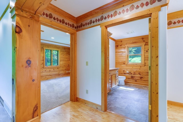 278 Vanity Dr, Shelby Twp, WI 54658 - hallway featuring wood walls, light wood finished floors, plenty of natural light, and baseboards