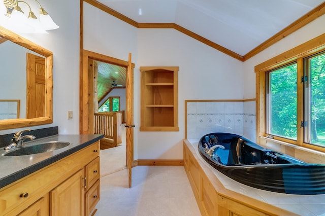 278 Vanity Dr, Shelby Twp, WI 54658 - bathroom featuring lofted ceiling, ornamental molding, vanity, and a whirlpool tub