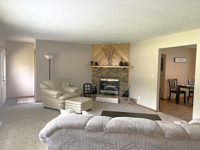16173 Discovery Cir, Park Rapids, MN 56470 - living room featuring carpet, a brick fireplace, a textured ceiling, and baseboards