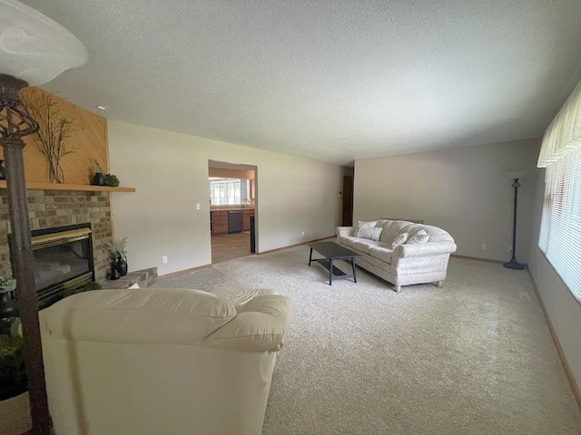 16173 Discovery Cir, Park Rapids, MN 56470 - living room featuring carpet floors, a brick fireplace, baseboards, and a textured ceiling